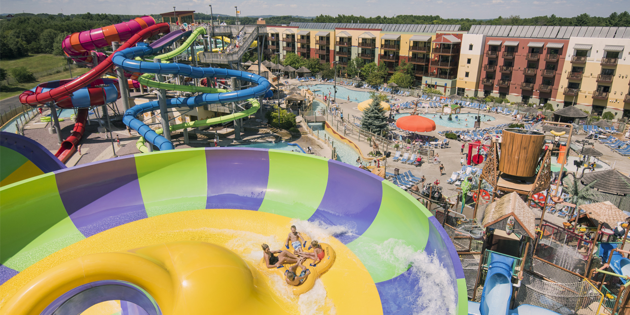 Four people in a tube on a waterslide at Kalahari outdoor waterpark in Wisconsin Dells.