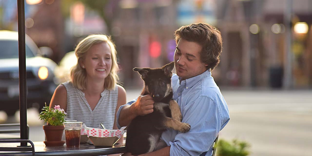 Couple with a dog in Downtown Wisconsin Dells