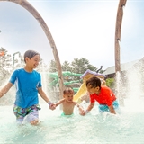 Children play at the outdoor waterpark at Wilderness Resort.