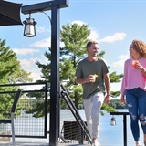A couple enjoying the outdoor space at Summer House Grill & Bar.