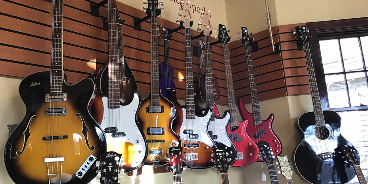 A selection of guitars and bass guitars.