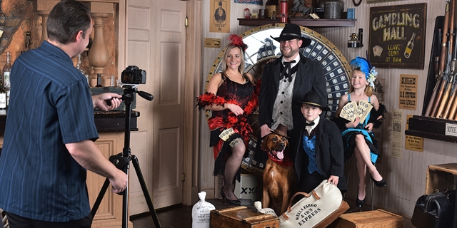 image of family dressed in cowboy attire getting their photo taken.