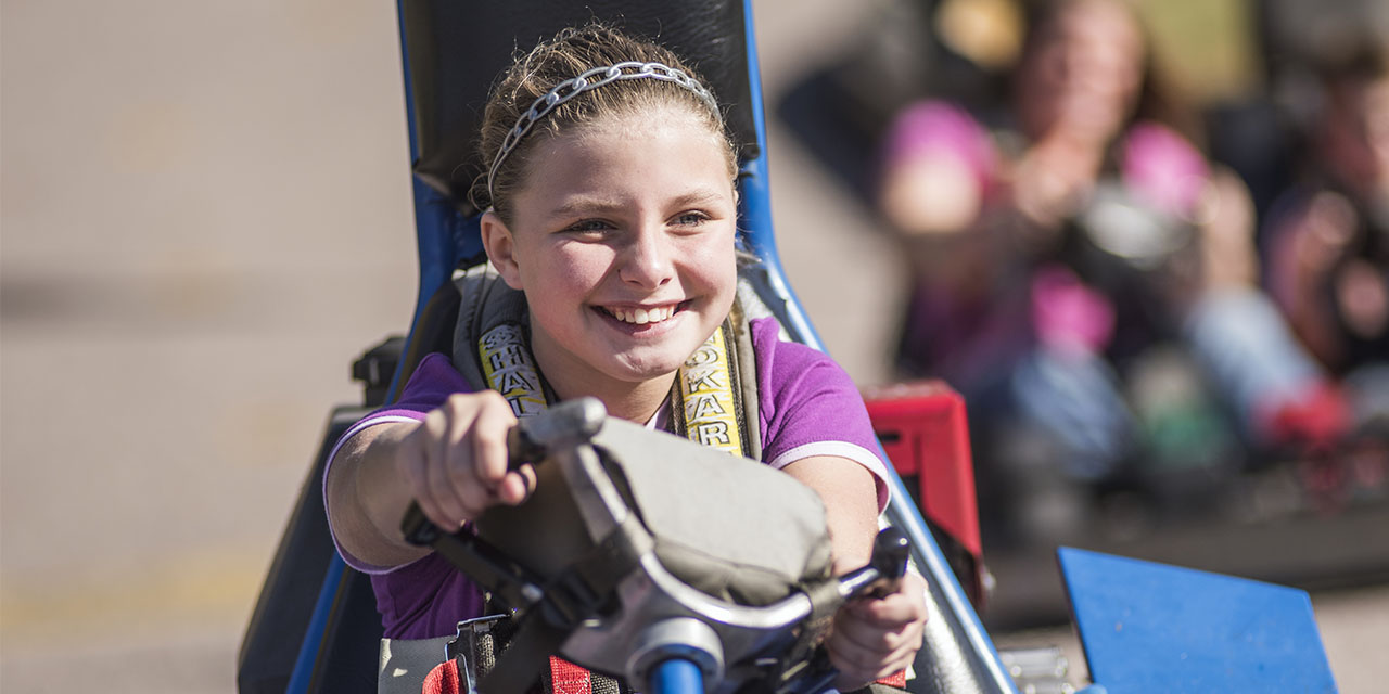 A girl racing go carts at ADare Go Carts in Wisconsin Dells.