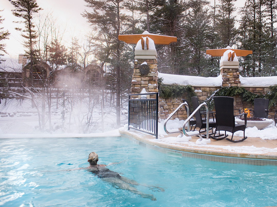 A woman swimming at Sundara Inn & Spa in Wisconsin Dells.