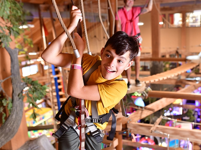 A family doing the ropes course at Wilderness Resort in Wisconsin Dells.