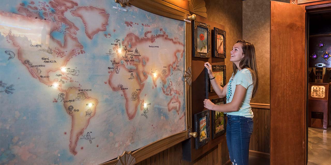 Girl playing at Booby Trap Escape Room
