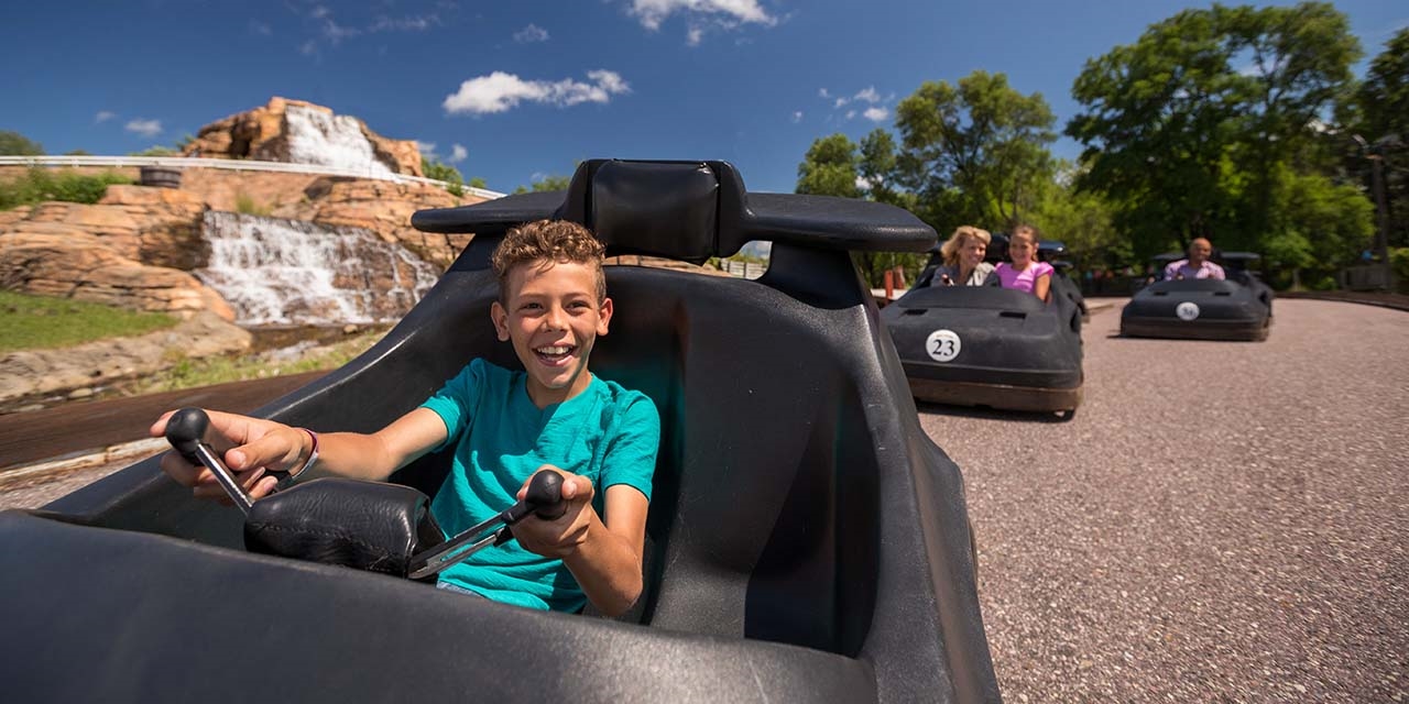 Boy driving go cart at big chief go carts