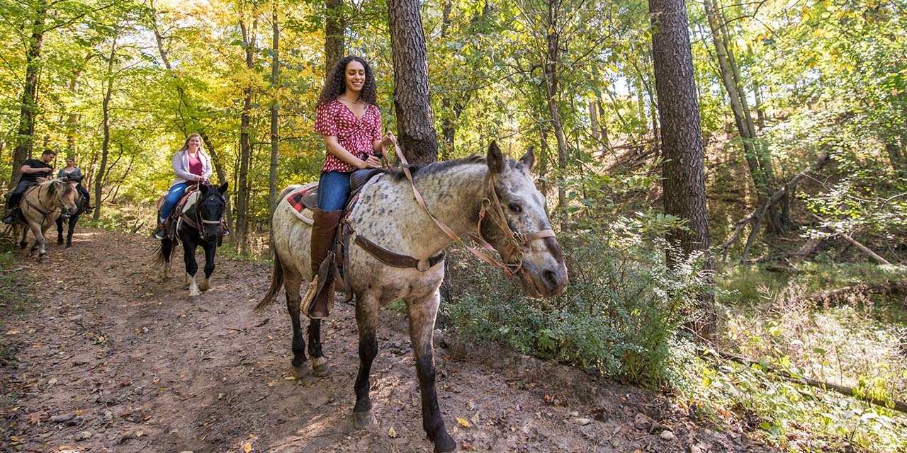 Women trail riding at Canyon Creek Stables