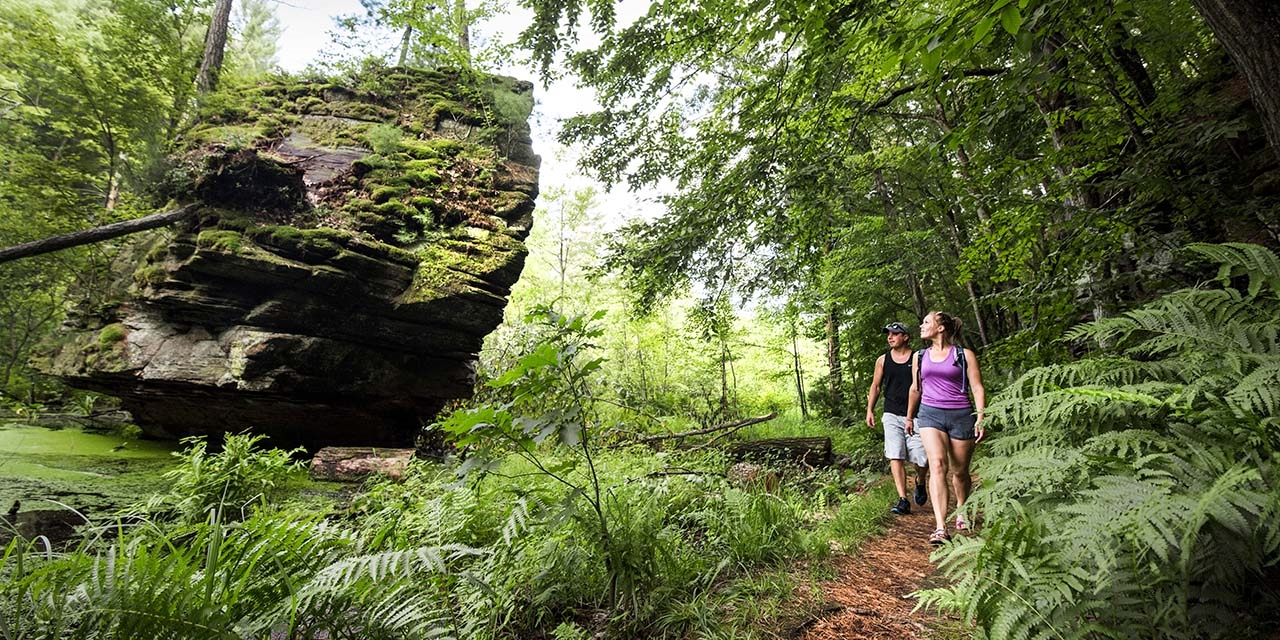 Couple hiking at Rocky Arbor State Park