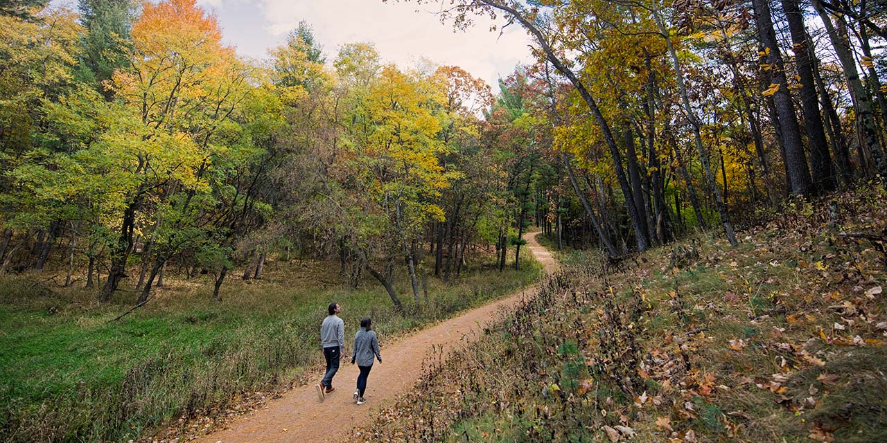 Couple hiking at Sundara Inn & Spa trails