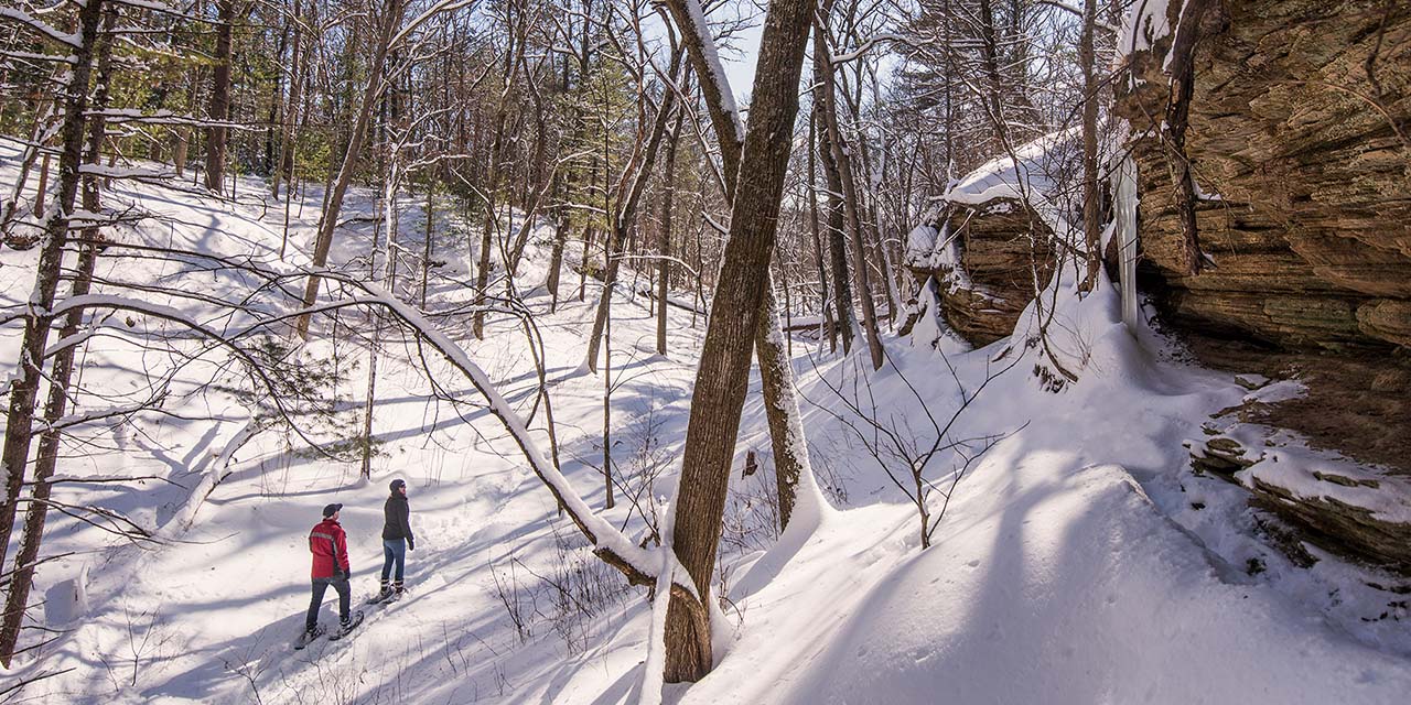 Couple snow shoeing at Mirror Lake State Park