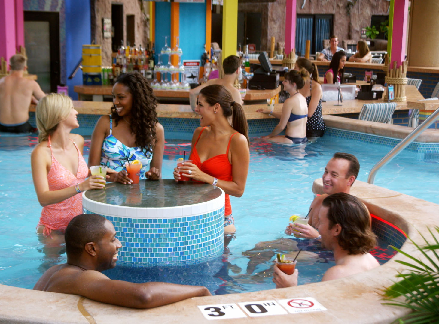 Group of fiends drinking at swim up bar at Wilderness Resort Waterpark