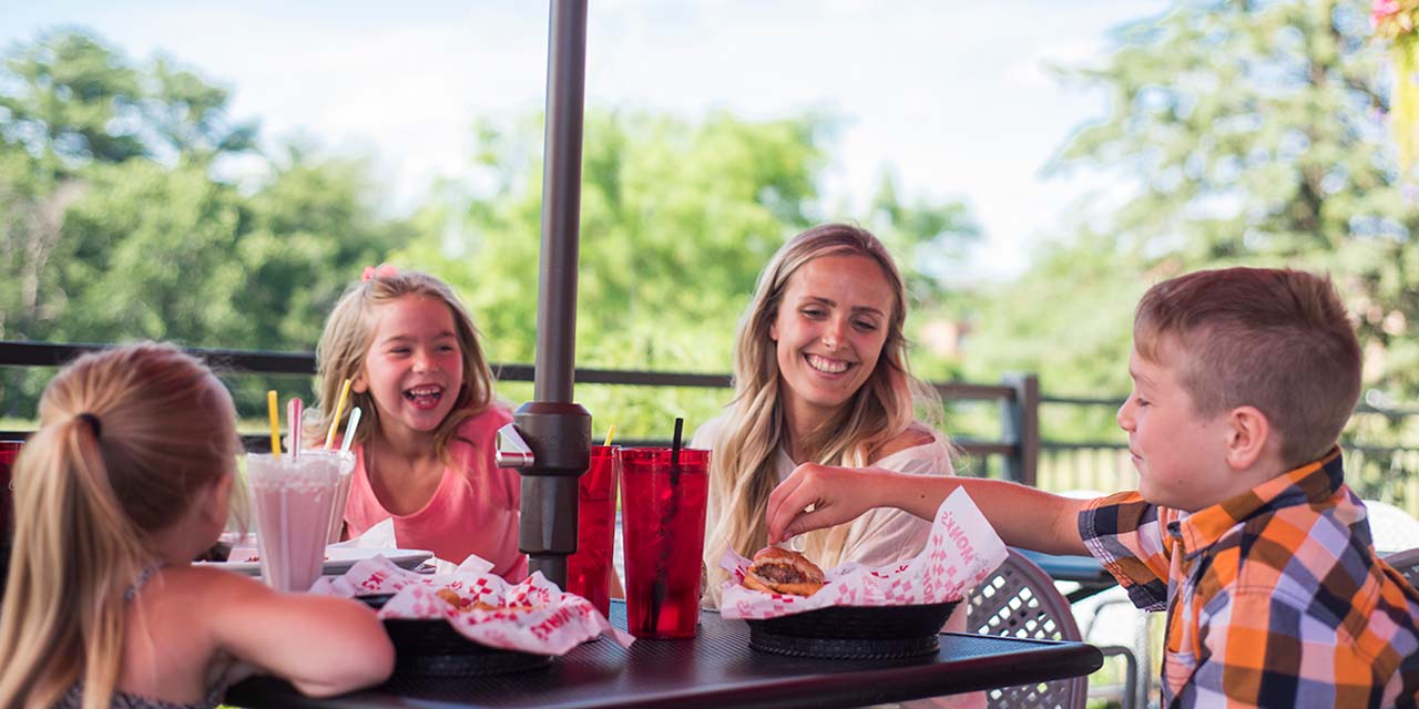 Family eating at Monk's Bar and Grill Lake Delton