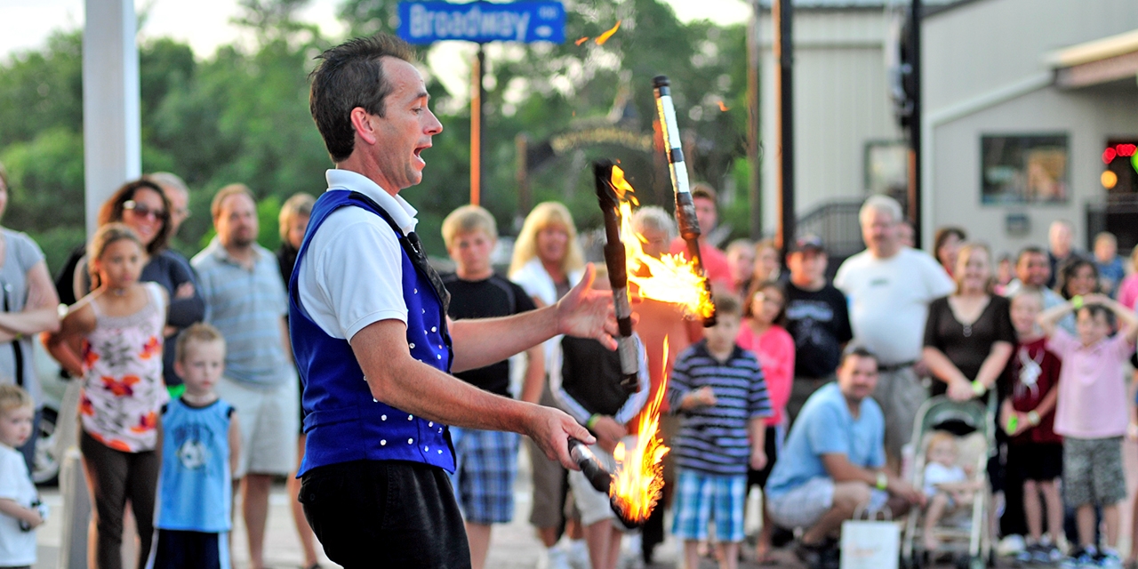 A man juggling fire in Wisconsin Dells.