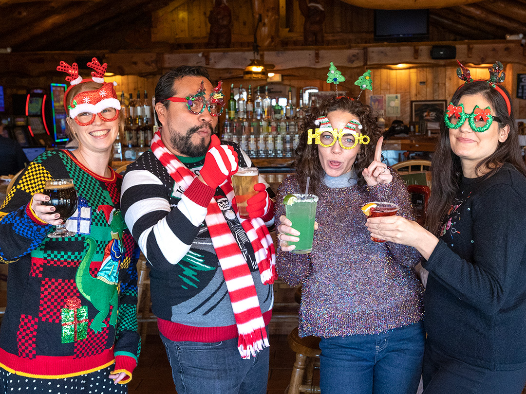 Ugly Sweater Pub Crawl participants having fun.