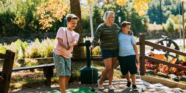 A family at Pirate's Cove Adventure Golf in Wisconsin Dells.