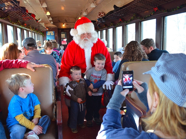 Santa Claus greeting people at Mid-Continent Railway train.