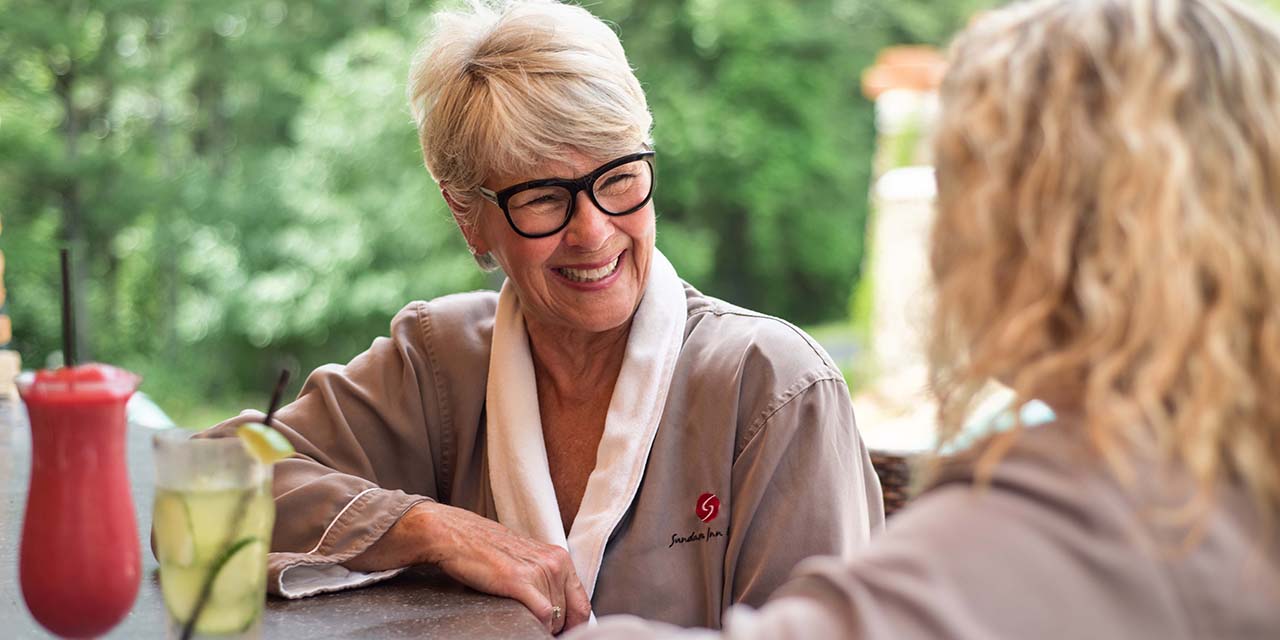 Two wimen laughing at Sundara Inn & Spa