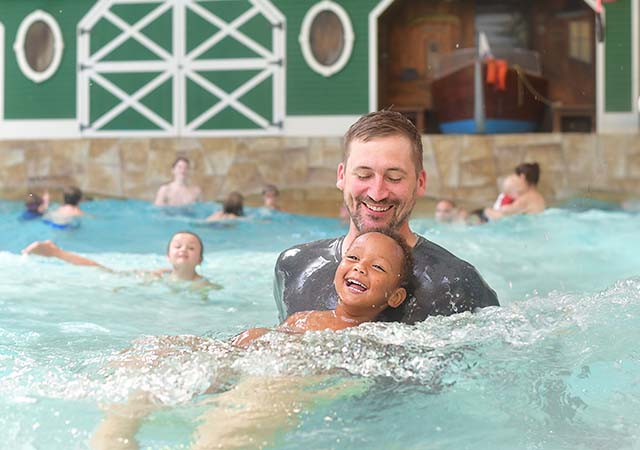 Father and son swimming at Great Wolf Lodge waterpark