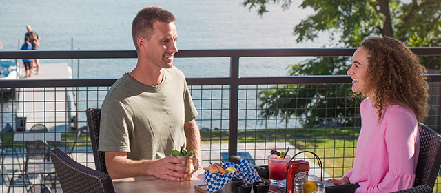 Man and woman eating outside at Summer House Grill & Bar