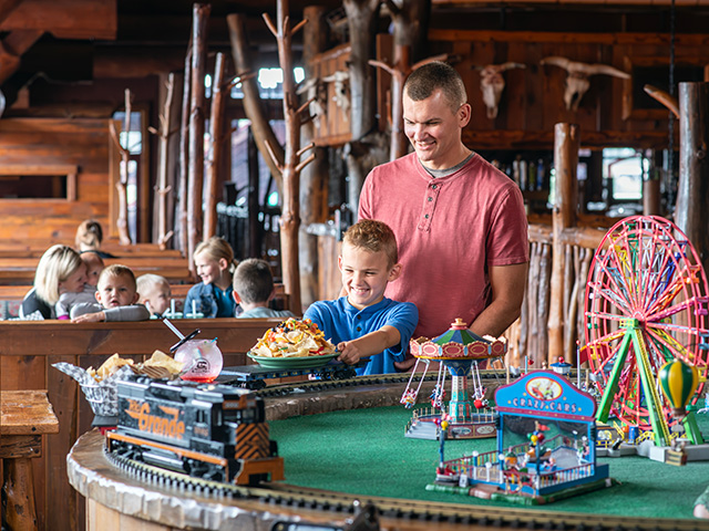 dad and son getting food off train