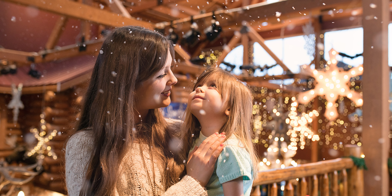 Mother and daughter in a holiday setting.