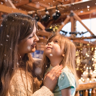 Mother and daughter in a holiday setting.