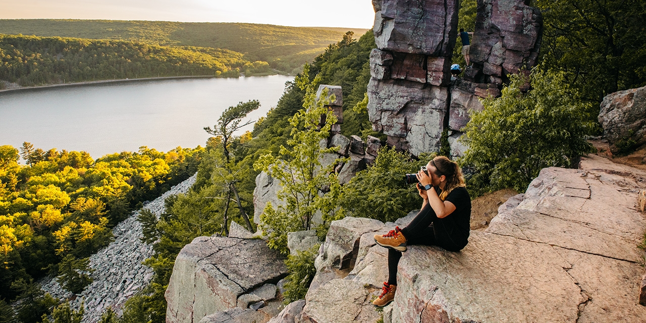 Woman taking pictures at Devil's Lake State Park