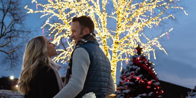 Couple in front of Tree of Light.