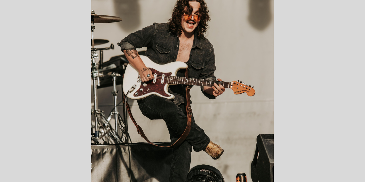 Erich Mobley playing guitar