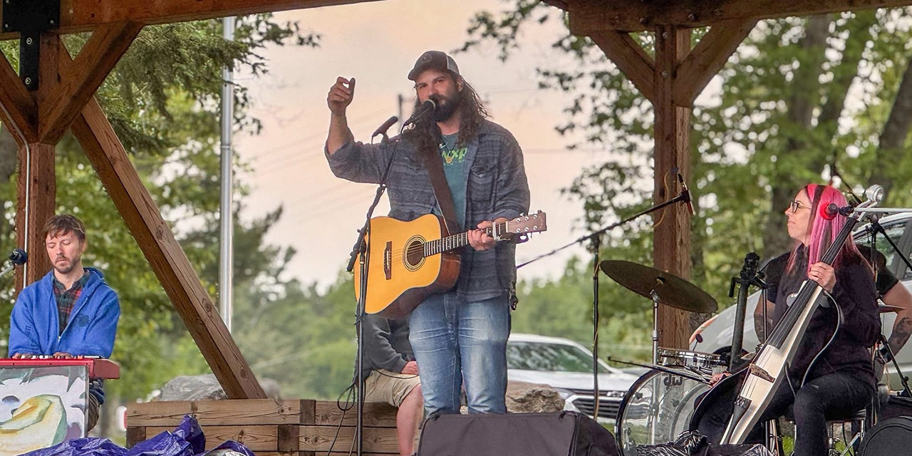 Sam Ness performing