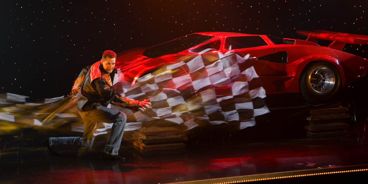 A sports car is unveiled during the Rick Wilcox Show in Wisconsin Dells