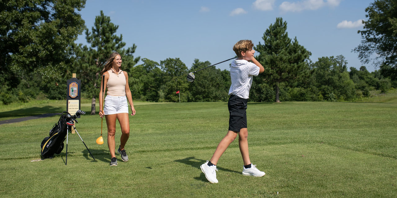 Mother and son golfing at Fairfield Hills.