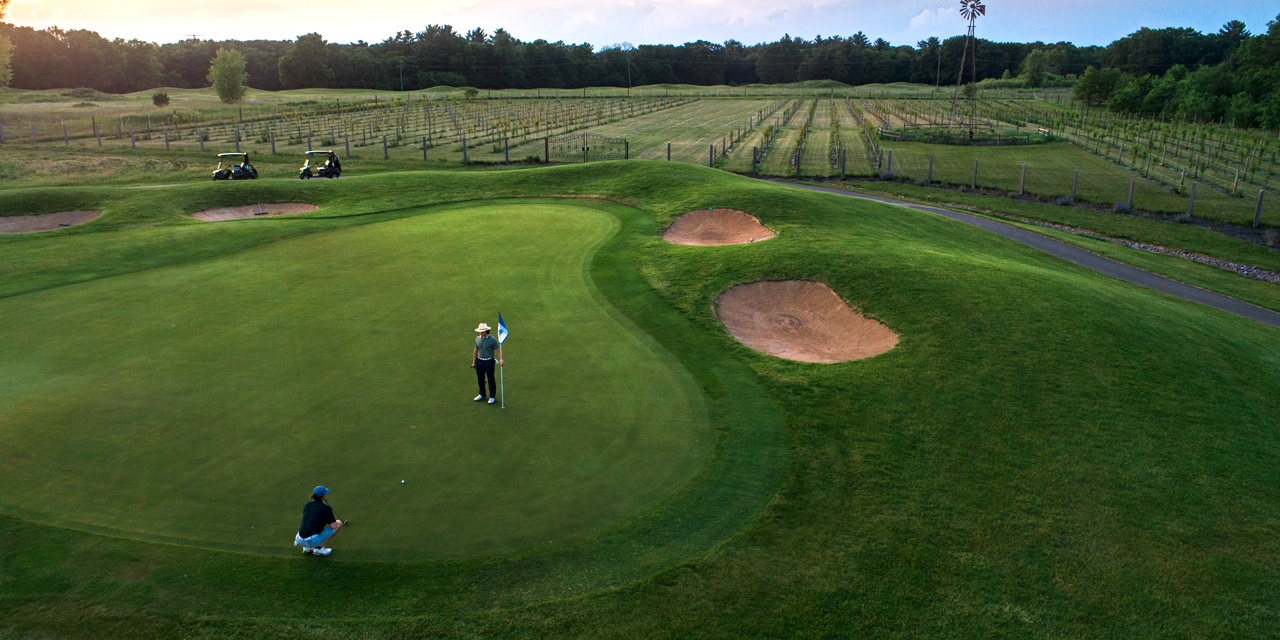 Two men playing golf at Trappers Turn.