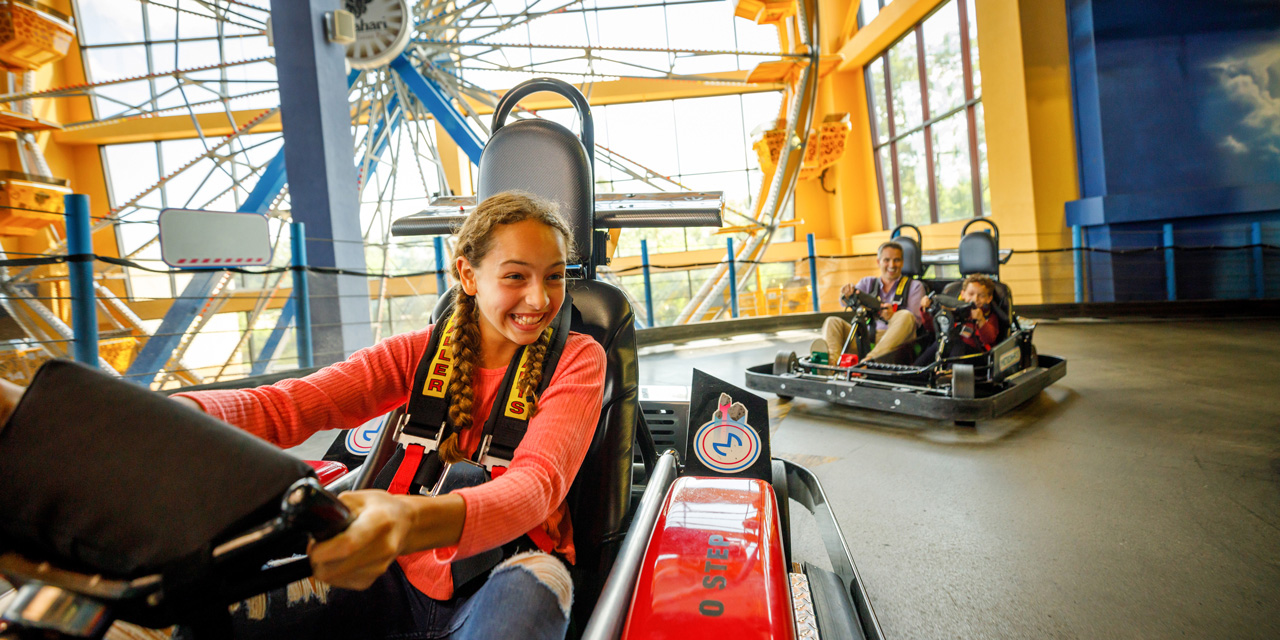 People riding go-carts at Tom Foolerys Adventure Park.