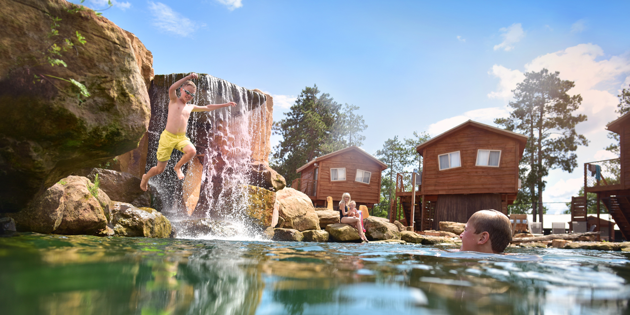 Family swimming at Natura Treescape Resort