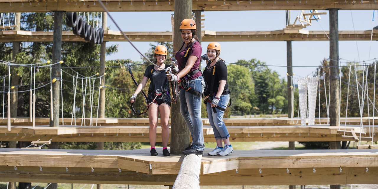 People enjoy the ropes course at Bigfoot Ropes Course in Wisconsin Dells.