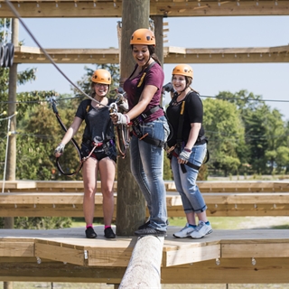 People enjoy the ropes course at Bigfoot Ropes Course in Wisconsin Dells.