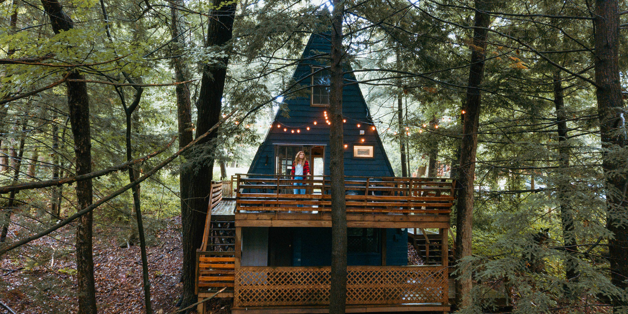 A woman stand on the deck of a vacation rental home in Wisconsin Dells.