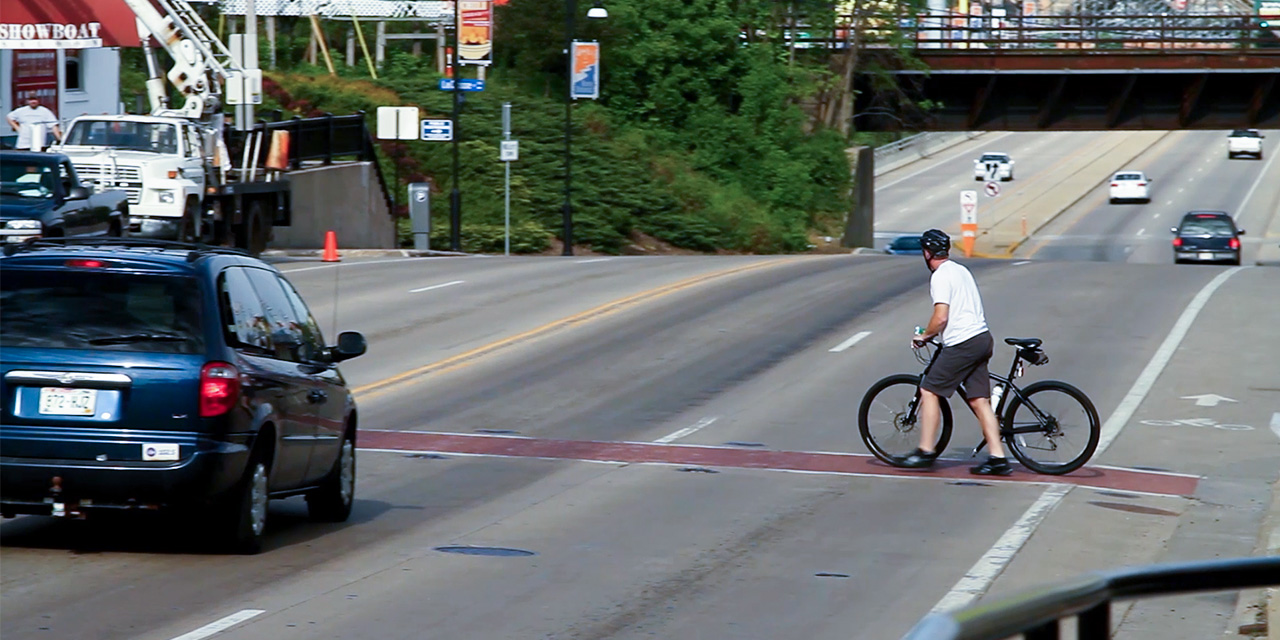 Bicycle rider on a road.