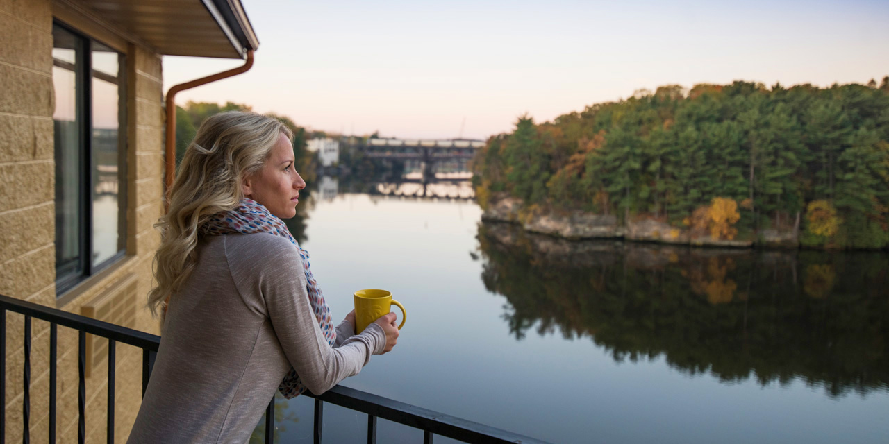 Woman enjoying Wisconsin Dells river view.