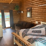 A cabin home bedroom with decorations.