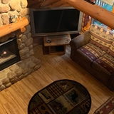 The living area and main entrance of a cabin home.