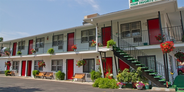 Fitzgerald's Motel exterior with flower bouquets.