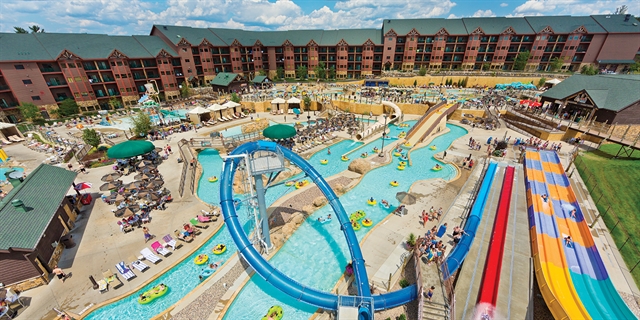 Outdoor waterpark with waterslides and lazy river.