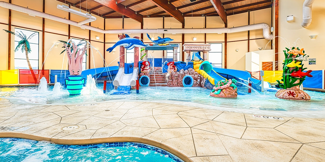 Indoor waterpark play area with waterslides.