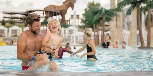 People play in an outdoor pool at Mt. Olympus Resort.