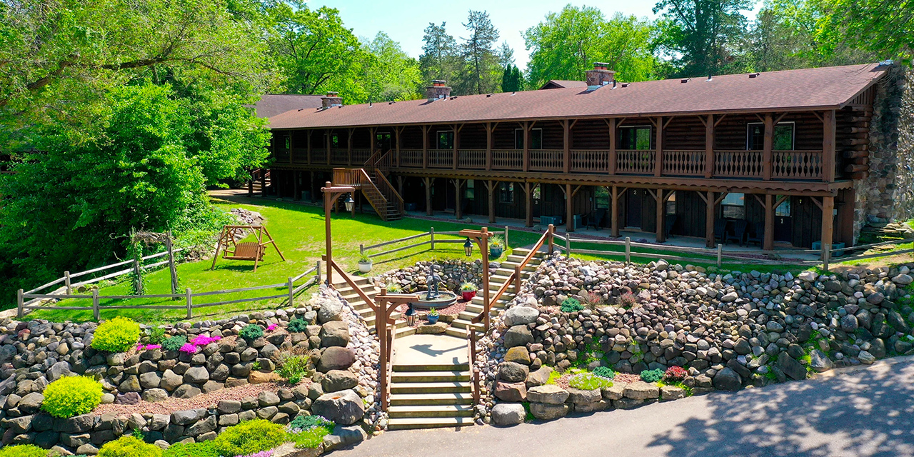 Log cabin resort exterior.