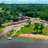 Aerial view of Pine Bay Lodge with the water and shoreline.
