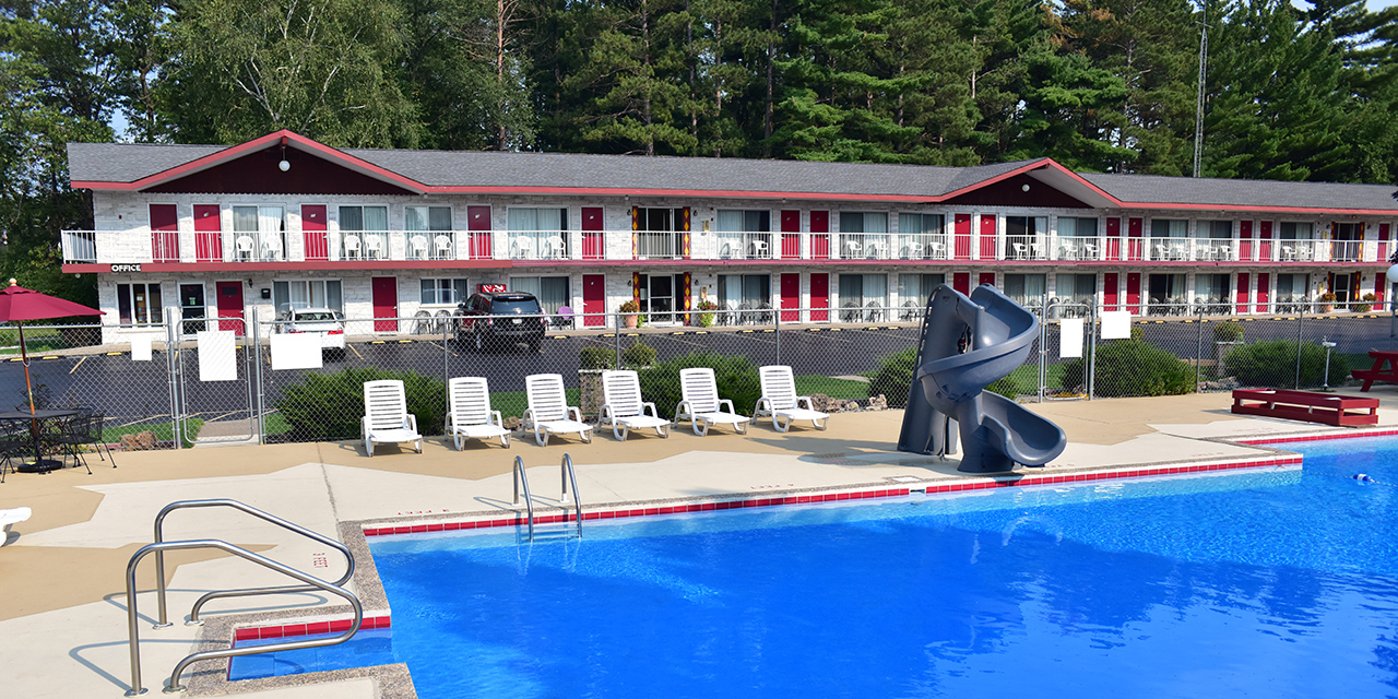 Exterior with outdoor pool and slide.